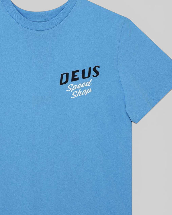 Baffle Haus Dogleg Tee in Bonnie Blue featuring a black and white Deus Speed Shop chest print on cotton jersey