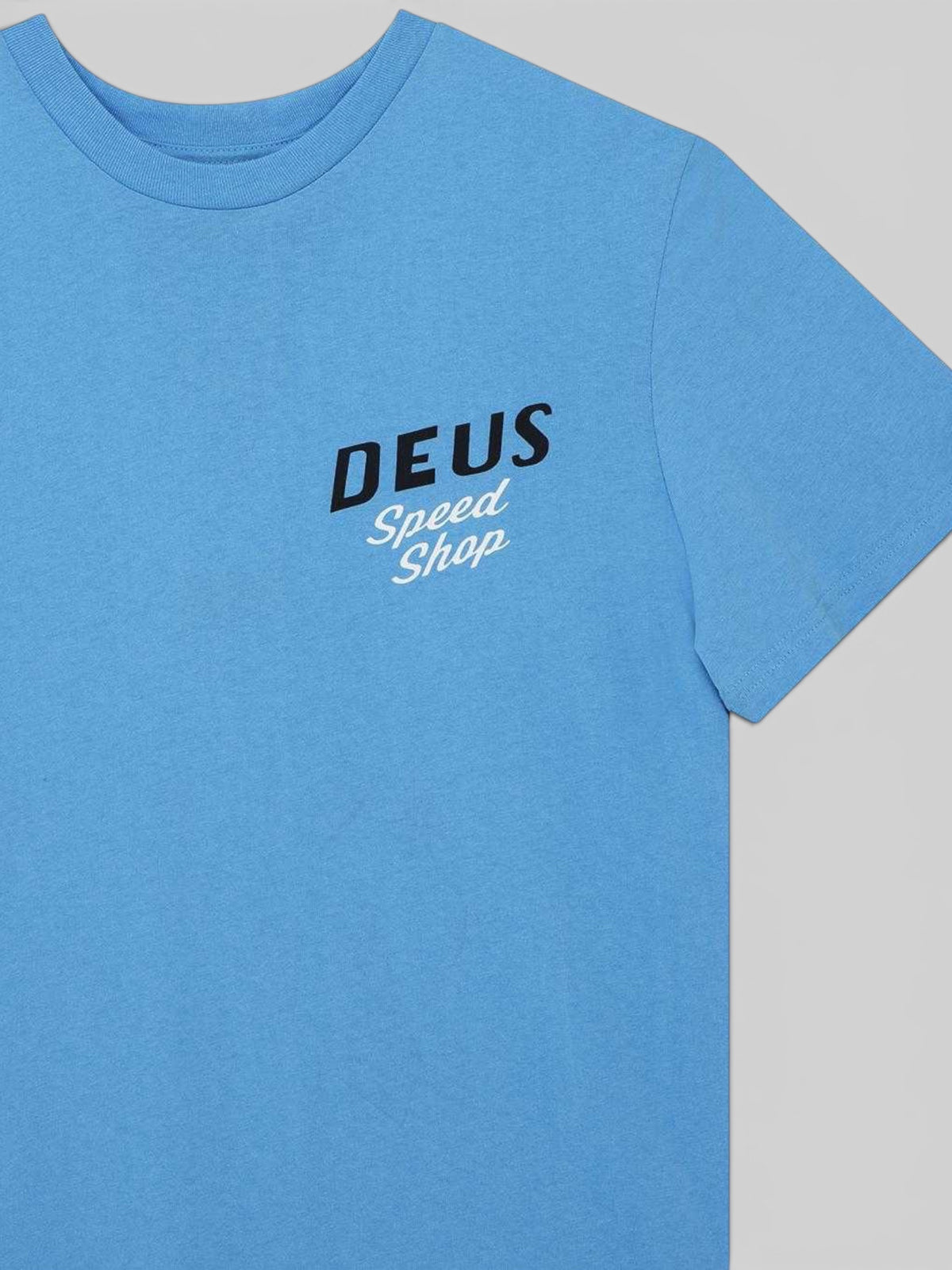 Baffle Haus Dogleg Tee in Bonnie Blue featuring a black and white Deus Speed Shop chest print on cotton jersey