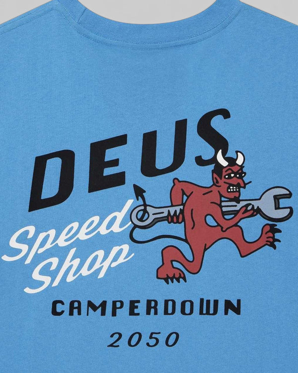 Baffle Haus Dogleg Tee in Bonnie Blue featuring a graphic print of a red devil holding a wrench on organic cotton