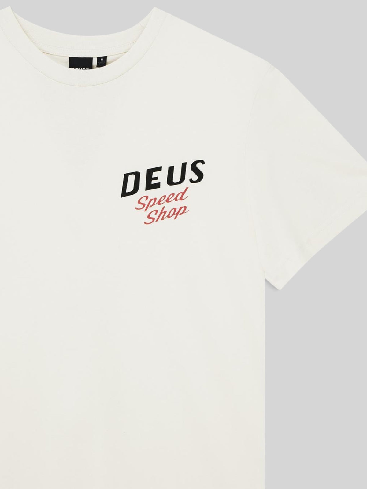 Baffle Haus Dogleg Tee in dirty white organic cotton with Deus Speed Shop chest graphic print