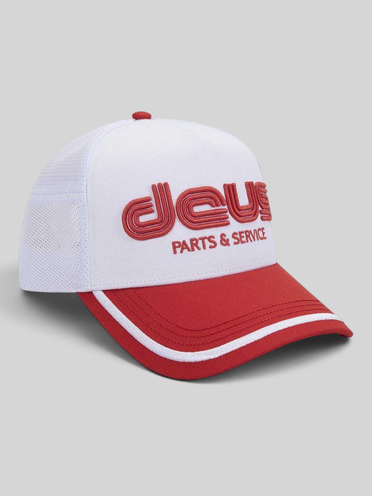 Baffle Haus Double Track Trucker hat in vintage white and red with embroidered Deus Parts & Service front logo.