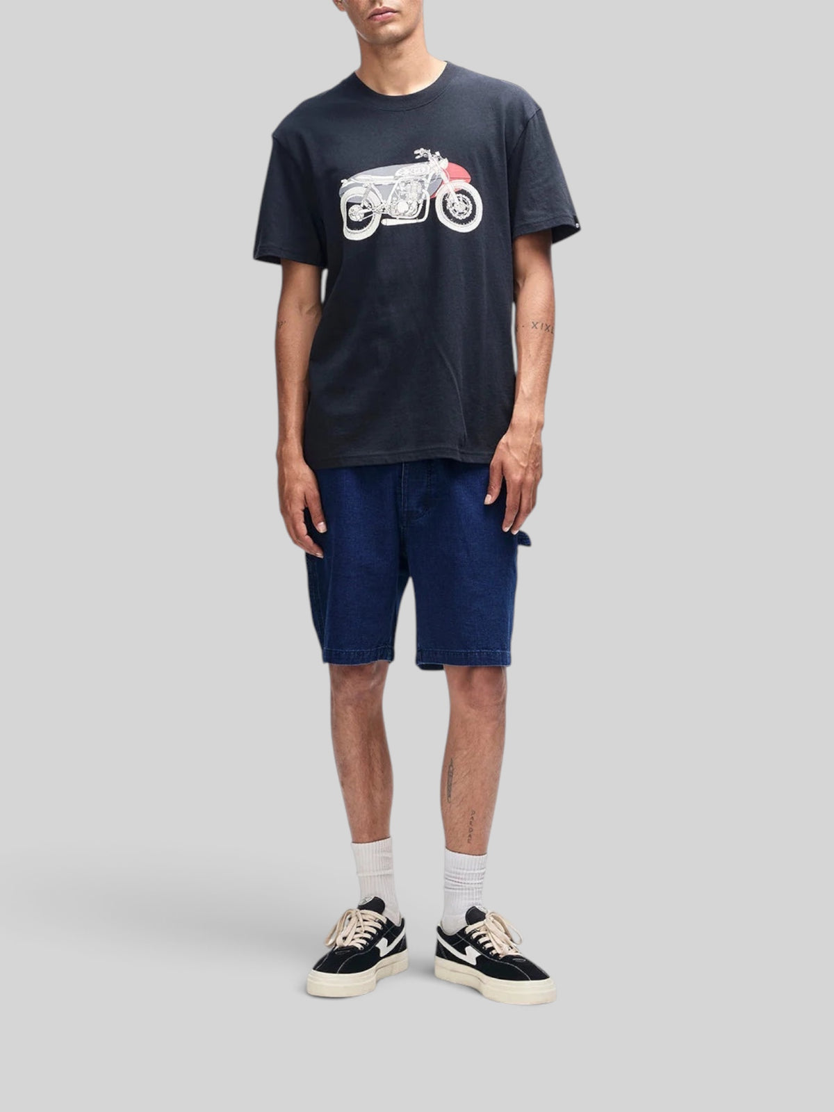 Baffle Haus Drovers Dog black organic cotton box fit t-shirt with motorcycle graphic print worn by a male model