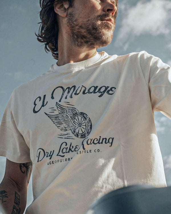 Baffle Haus off-white cotton t-shirt featuring a vintage El Mirage dry lake racing graphic with a winged wheel