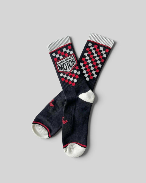 Baffle Haus Age Of Glory Enthusiasts socks in black, red, and off-white with a vintage checkered motorcycle design.