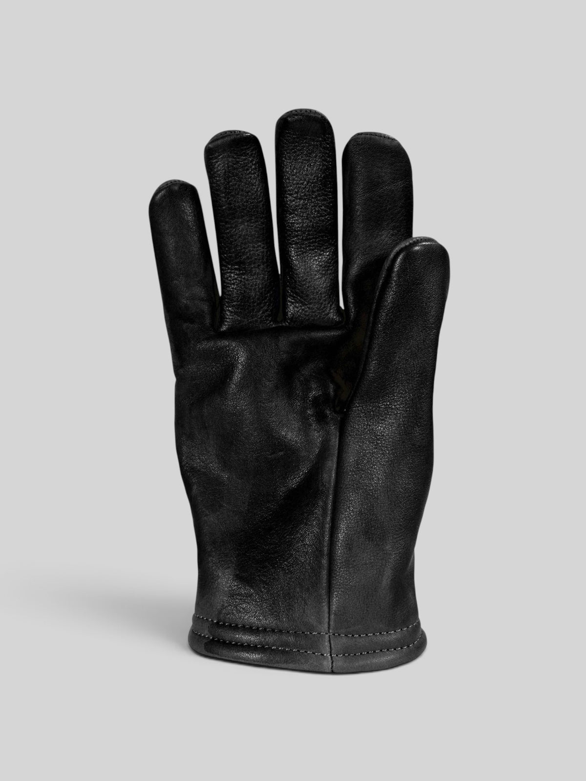 Baffle Haus Freewheeler XTM black cowhide leather motorcycle gloves with a short-wrist design and pre-curved fit.