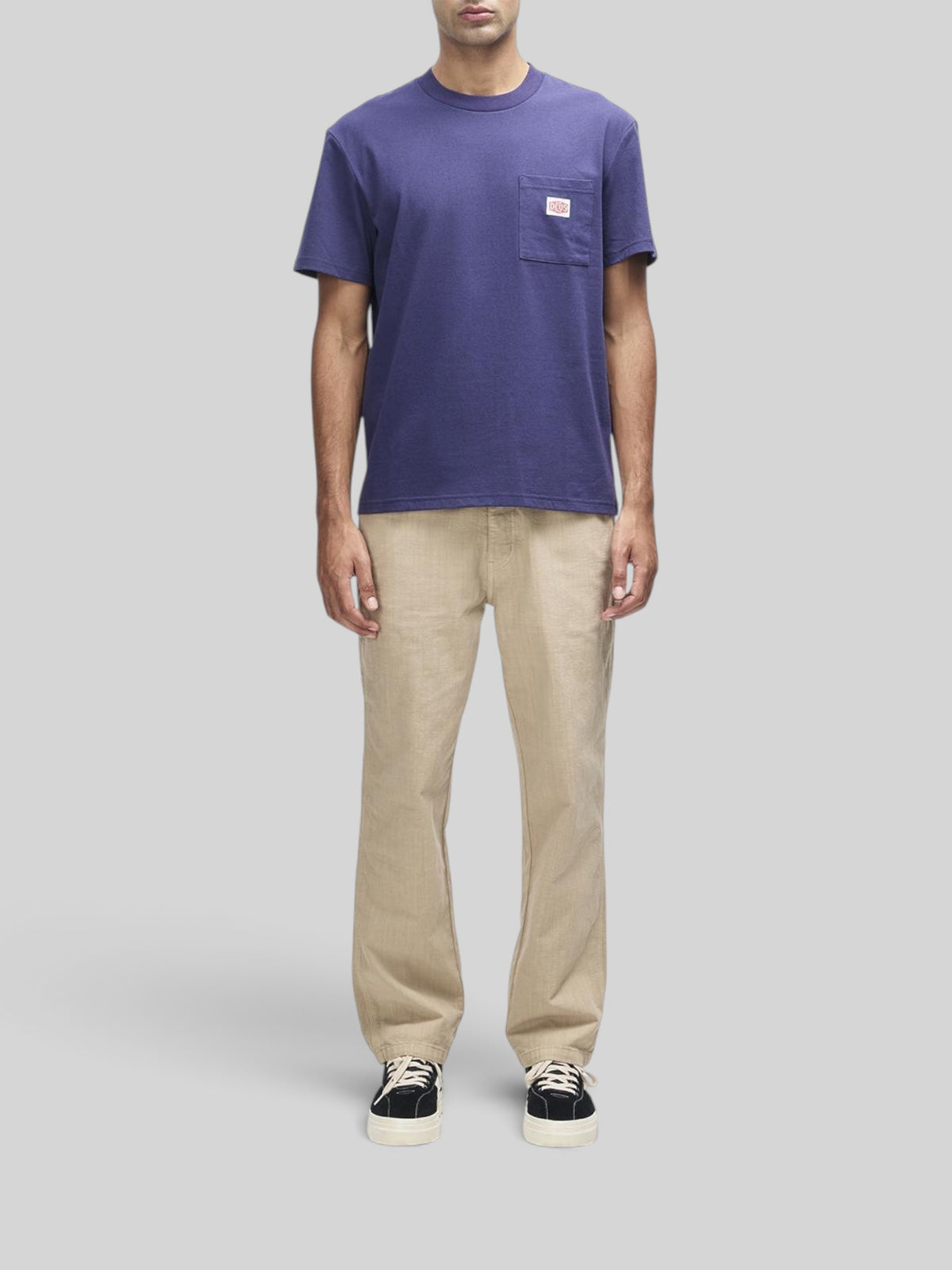 Baffle Haus French Blue box fit short sleeve t-shirt with a chest pocket and brand label on a male model