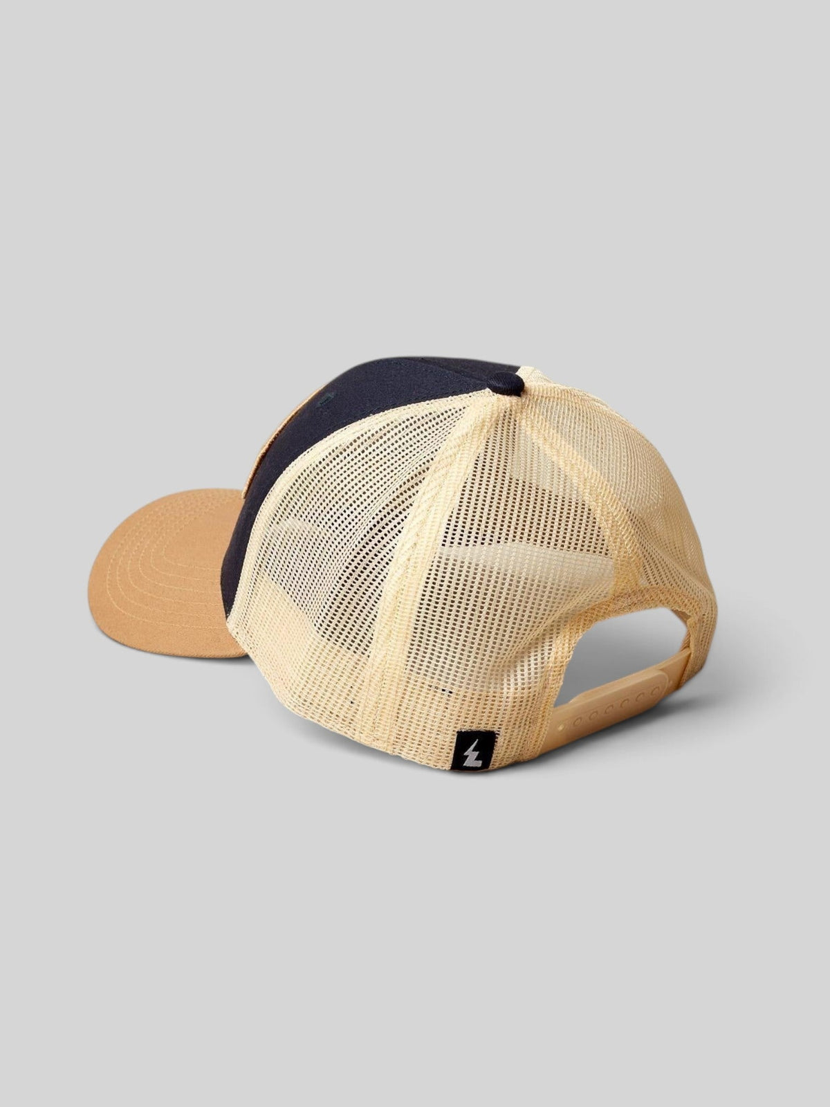 Baffle Haus gold and navy trucker cap with breathable mesh back panel and adjustable snapback closure