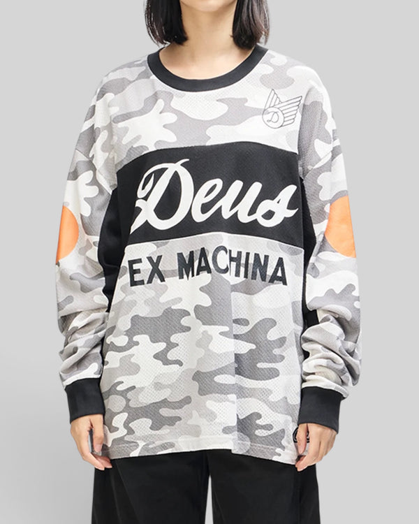 Baffle Haus grey camo moto jersey with graphic chest prints, loose fit, and orange sleeve accents on a model