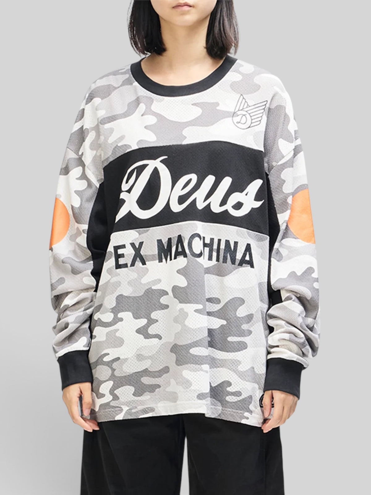 Baffle Haus grey camo moto jersey with graphic chest prints, loose fit, and orange sleeve accents on a model