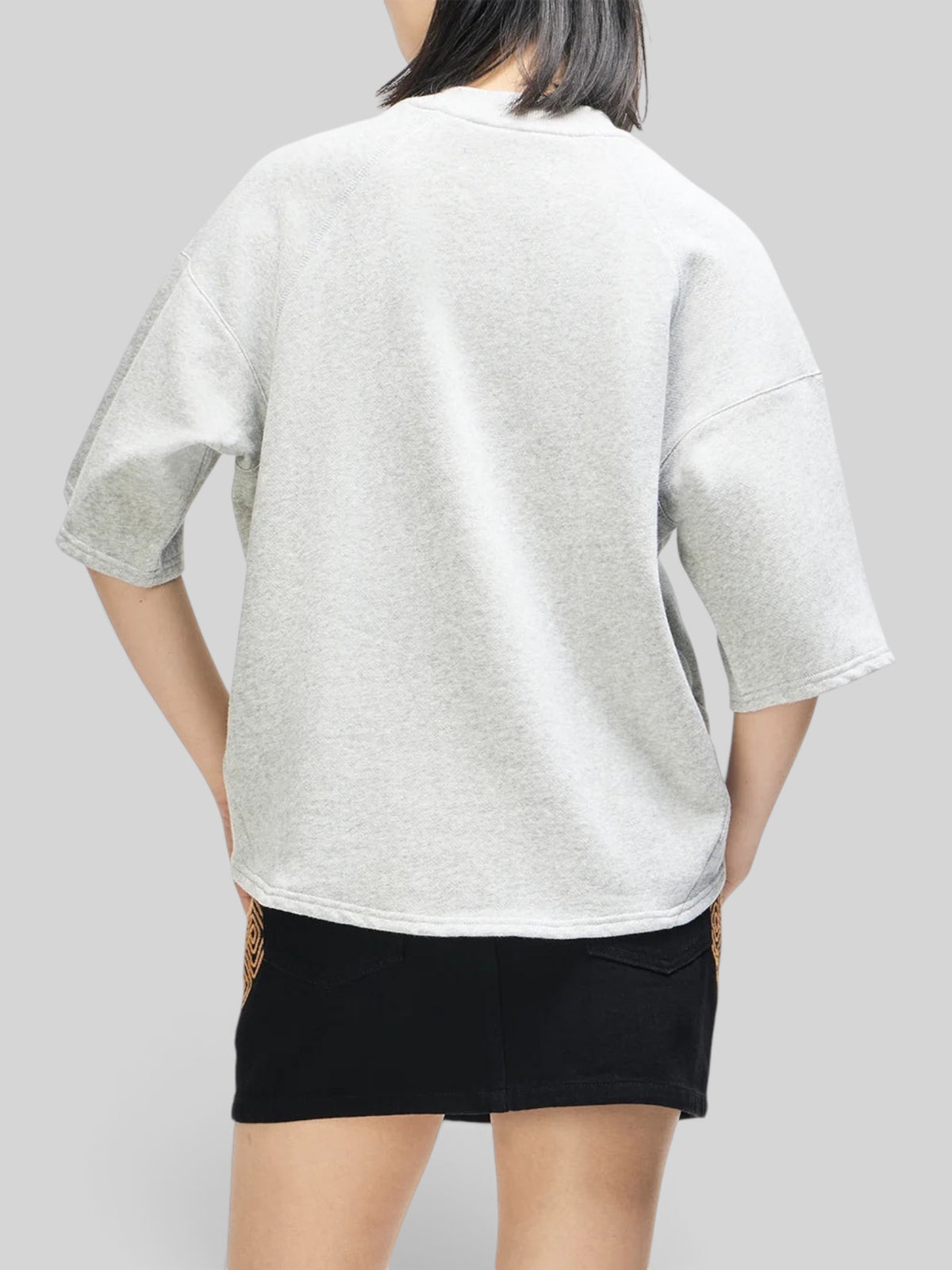 Baffle Haus La Eight Crew in grey marle organic cotton brushed fleece with relaxed fit and 3/4 sleeves, back view.