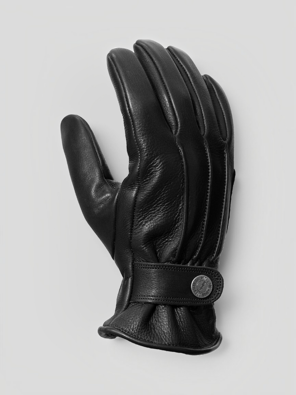 Baffle Haus Grinder black full-grain cowhide leather motorcycle gloves with pre-curved fingers and button closure.