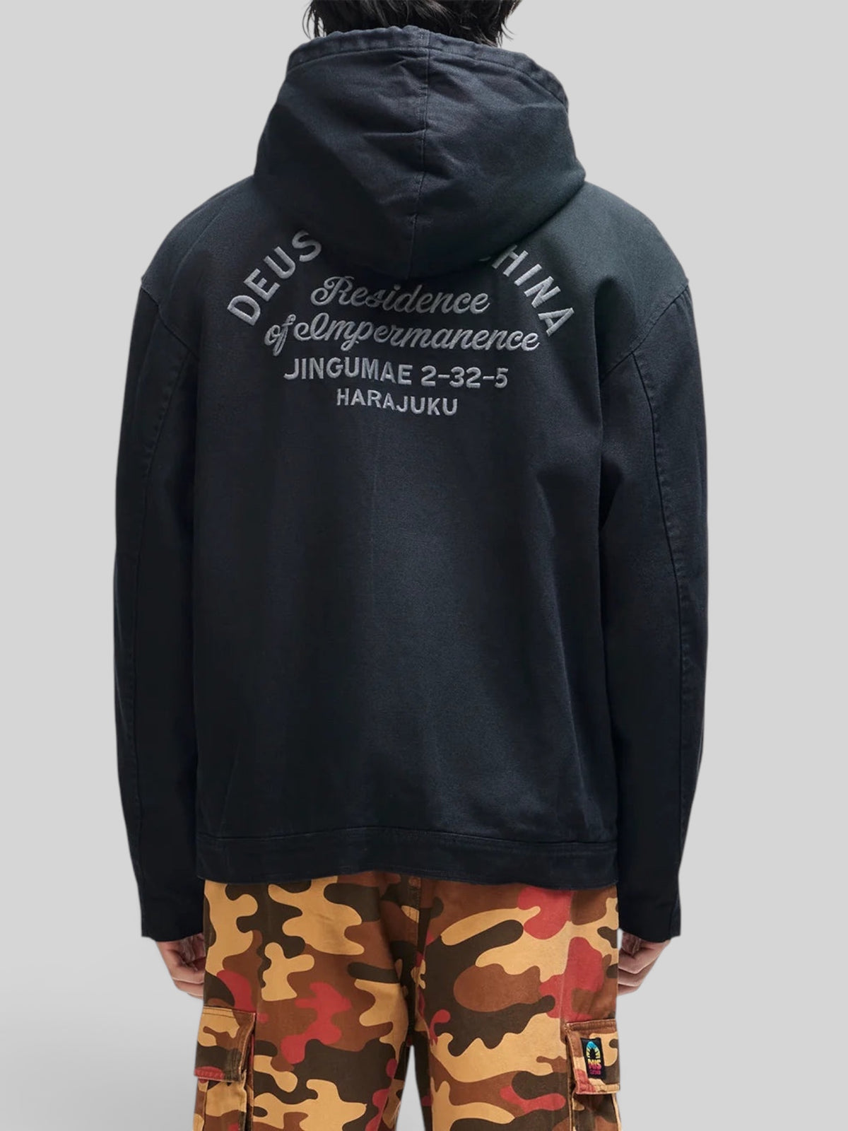 Baffle Haus Harajuku hooded work jacket in black cotton canvas with embroidered back art, shown from the rear.