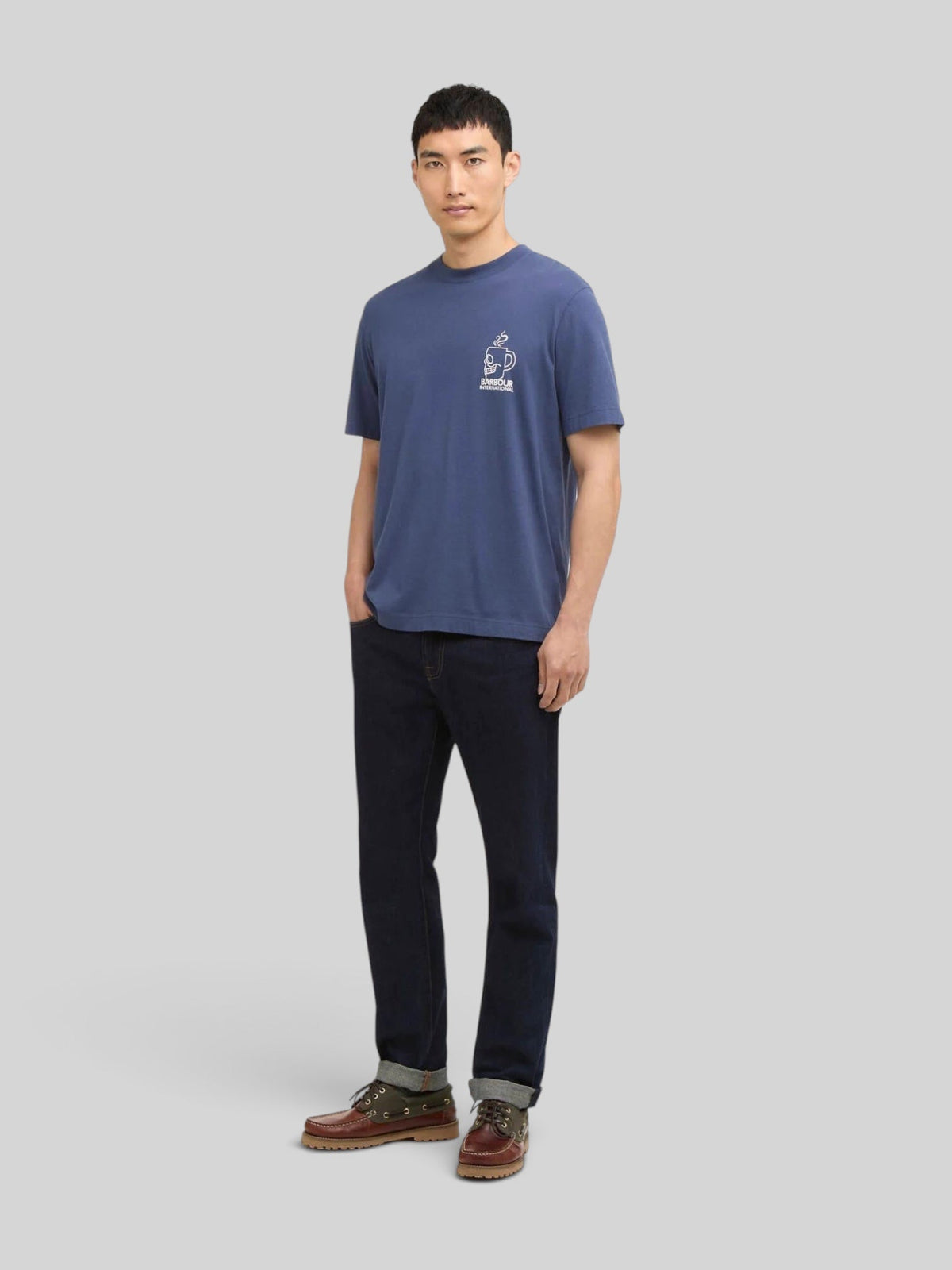 Baffle Haus International Staithes blue cotton graphic t-shirt with Broken Bone Cafe chest print on a male model