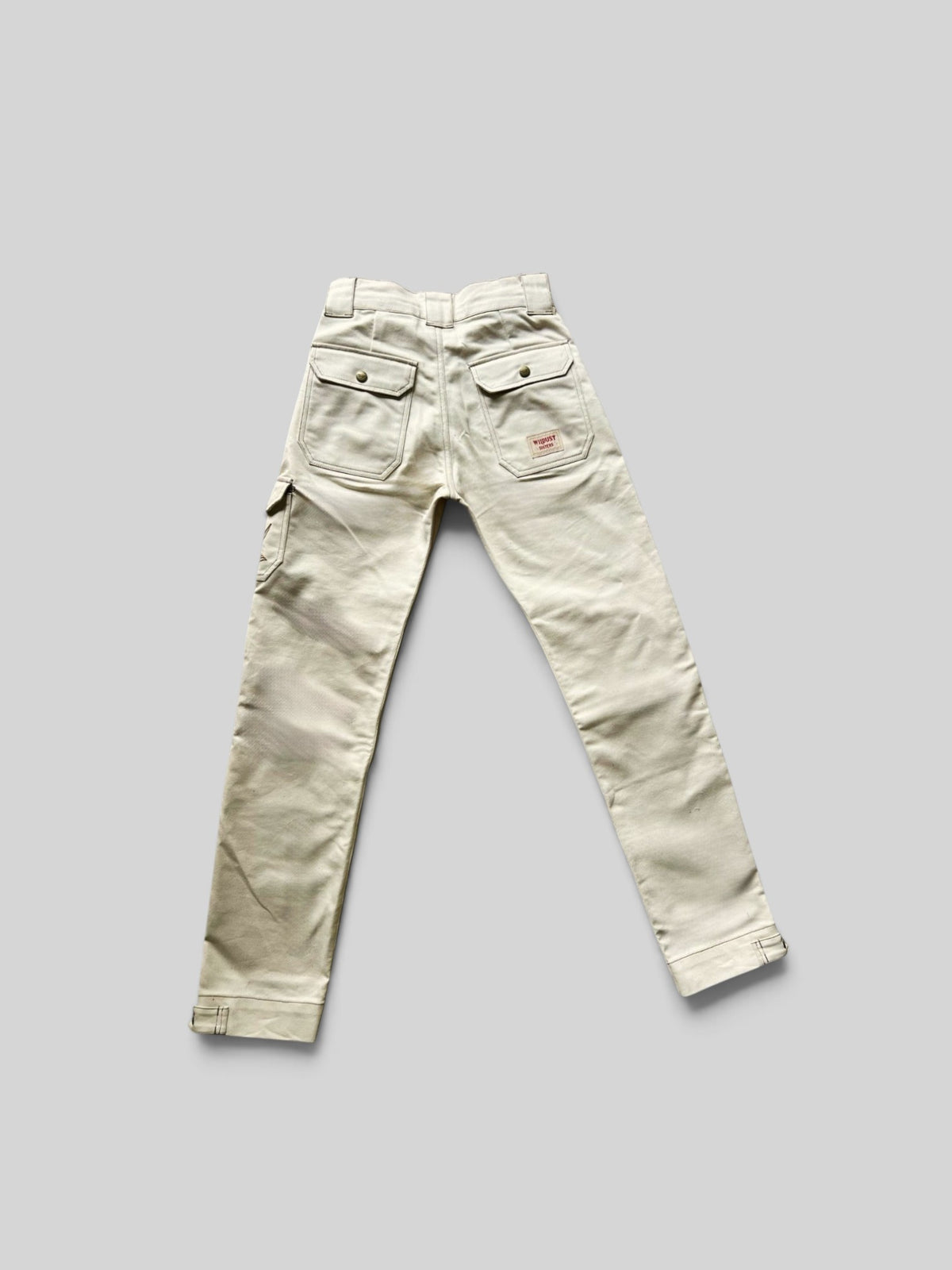 Baffle Haus ivory cargo motorcycle trousers with back patch pockets and workwear-inspired stitching