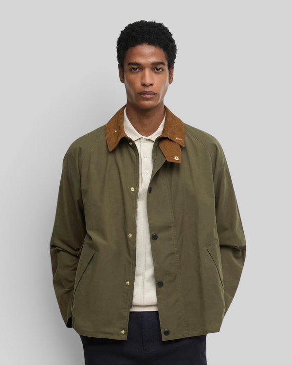 Baffle Haus Icons Transport casual jacket in ivy green with a brown corduroy collar worn by a male model.