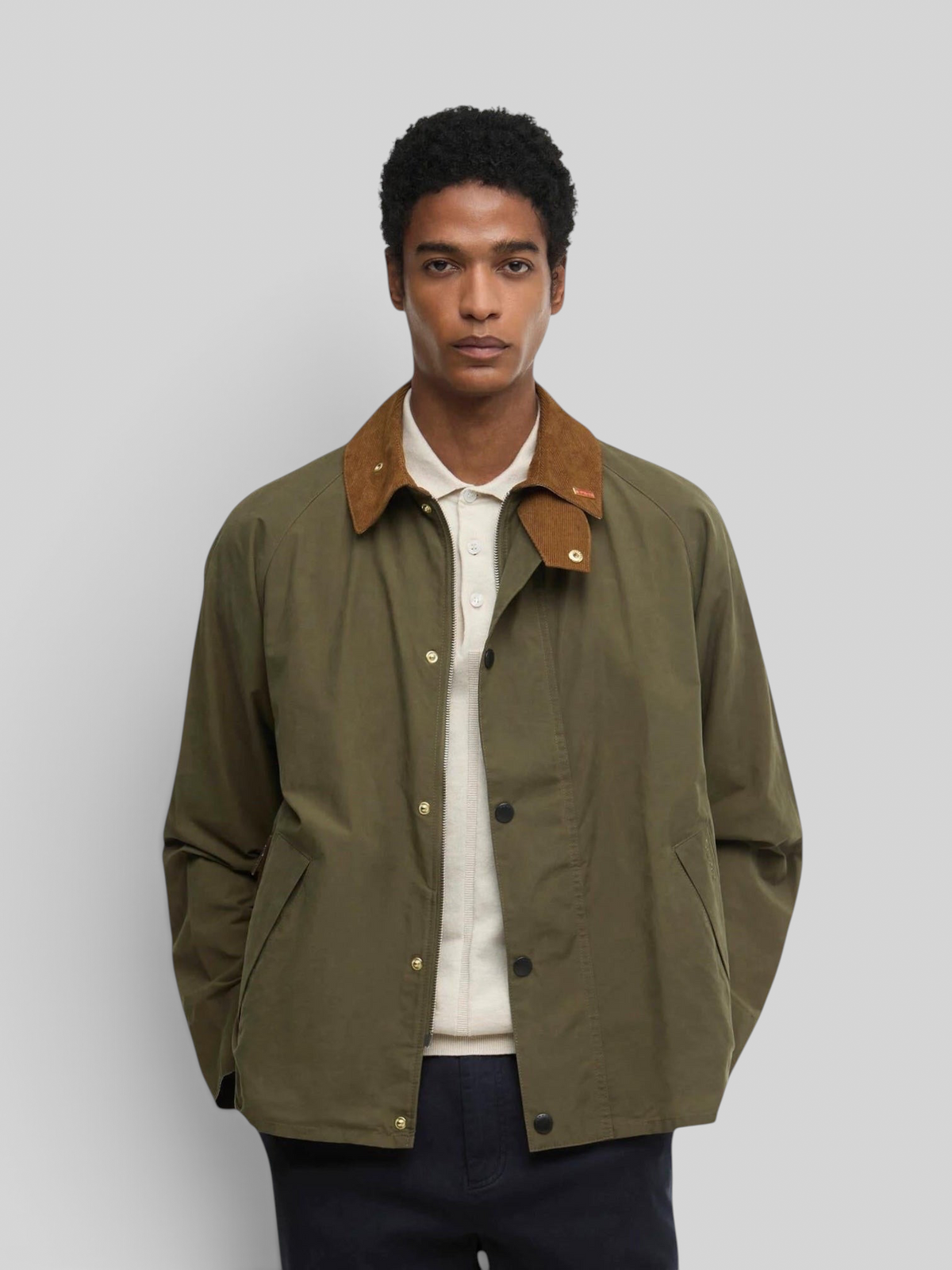 Baffle Haus Icons Transport casual jacket in ivy green with a brown corduroy collar worn by a male model.
