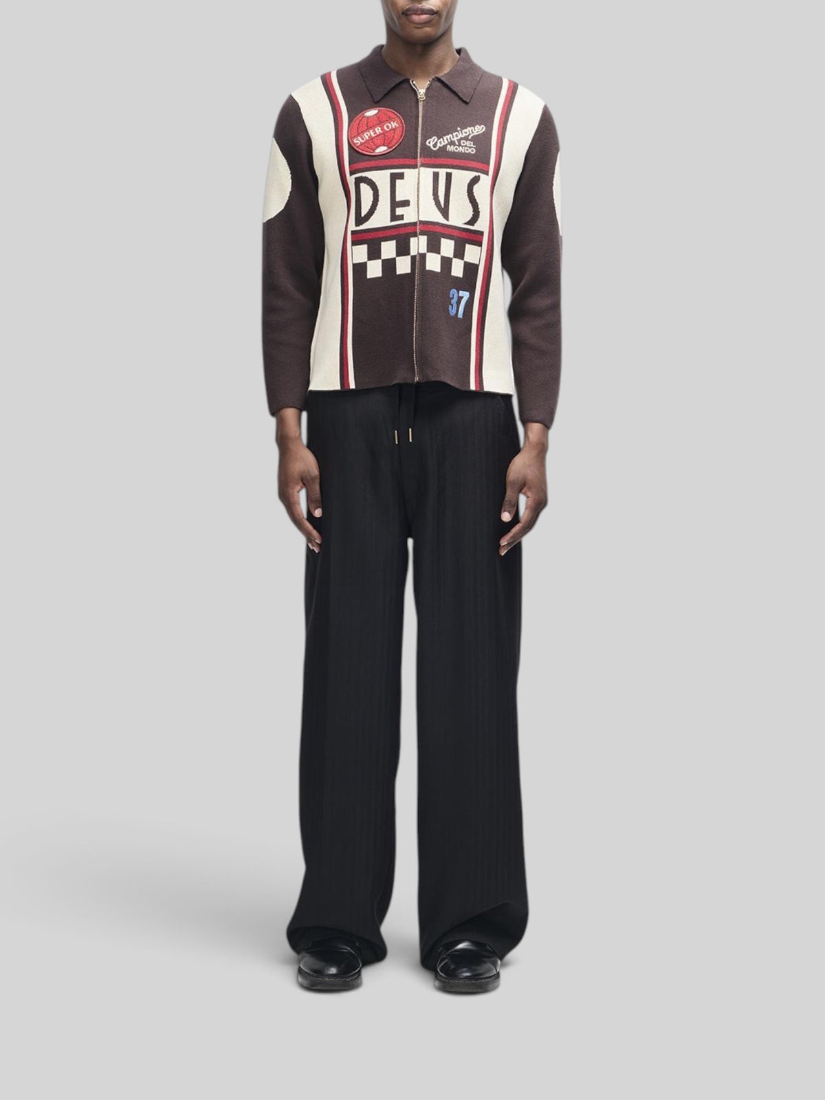 Baffle Haus Monte Carlo knit cardigan in java brown with motorsport-inspired graphic jacquard and embroidery patches.