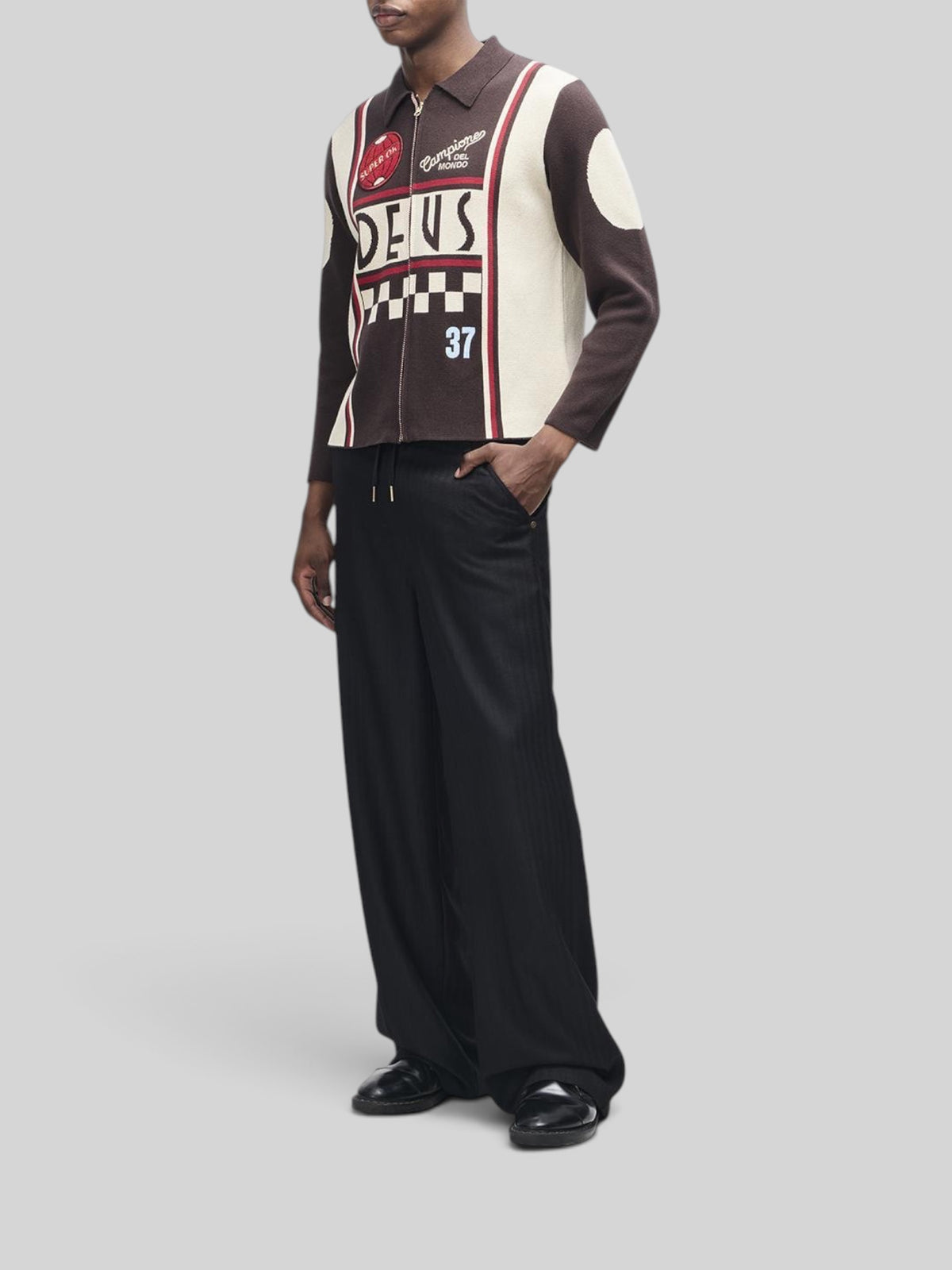 Baffle Haus Monte Carlo knit cardigan in java brown with moto-inspired graphic jacquard, zip front, and patches.