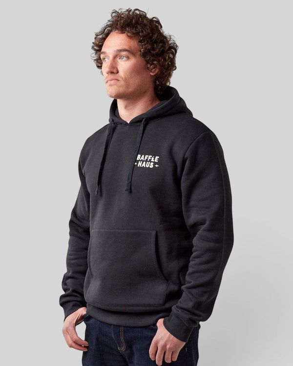 Baffle Haus jet black heavyweight cotton blend hoodie with white chest logo worn by a model