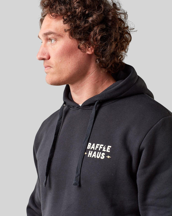 Baffle Haus jet black heavyweight cotton-blend hoodie with white Coffee & Motors chest logo on a male model