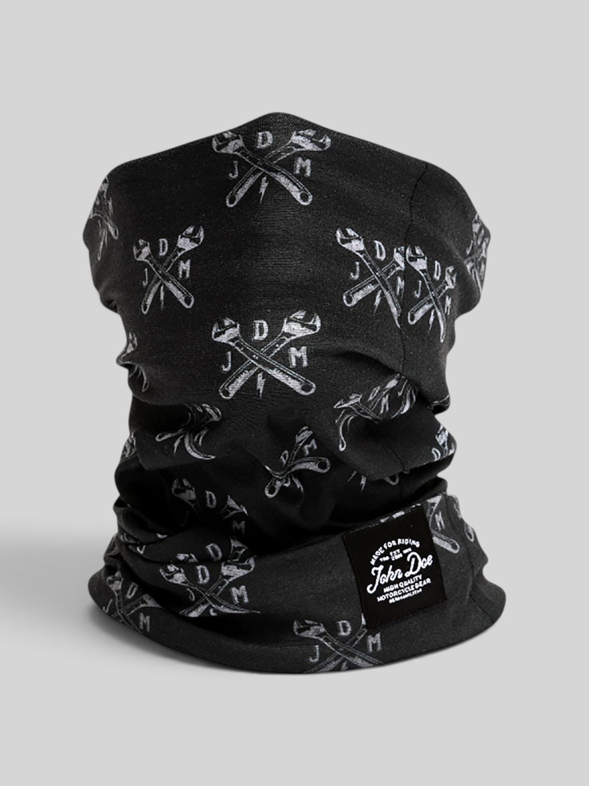 Baffle Haus John Doe black neck tube with white JDM wrench print, made from breathable Coolmax microfiber.
