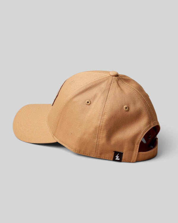 Baffle Haus khaki baseball cap with a structured crown, curved brim, and small logo tab on the back strap.
