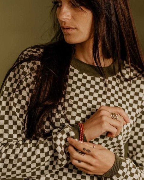 Baffle Haus Wildust vintage khaki knitted jumper with a black and white checkerboard pattern and ribbed collar