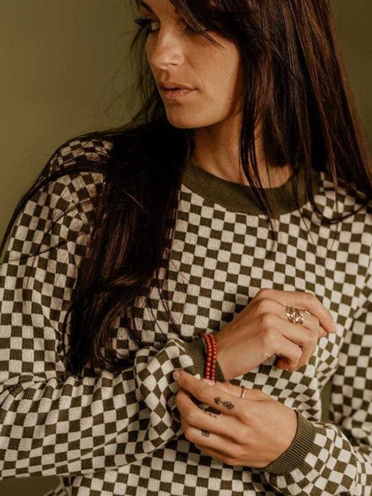 Baffle Haus Wildust vintage khaki knitted jumper with a black and white checkerboard pattern and ribbed collar