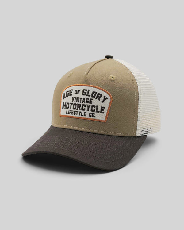 Baffle Haus Buddy trucker cap in khaki and dark grey with a vintage motorcycle patch and white mesh back panel.