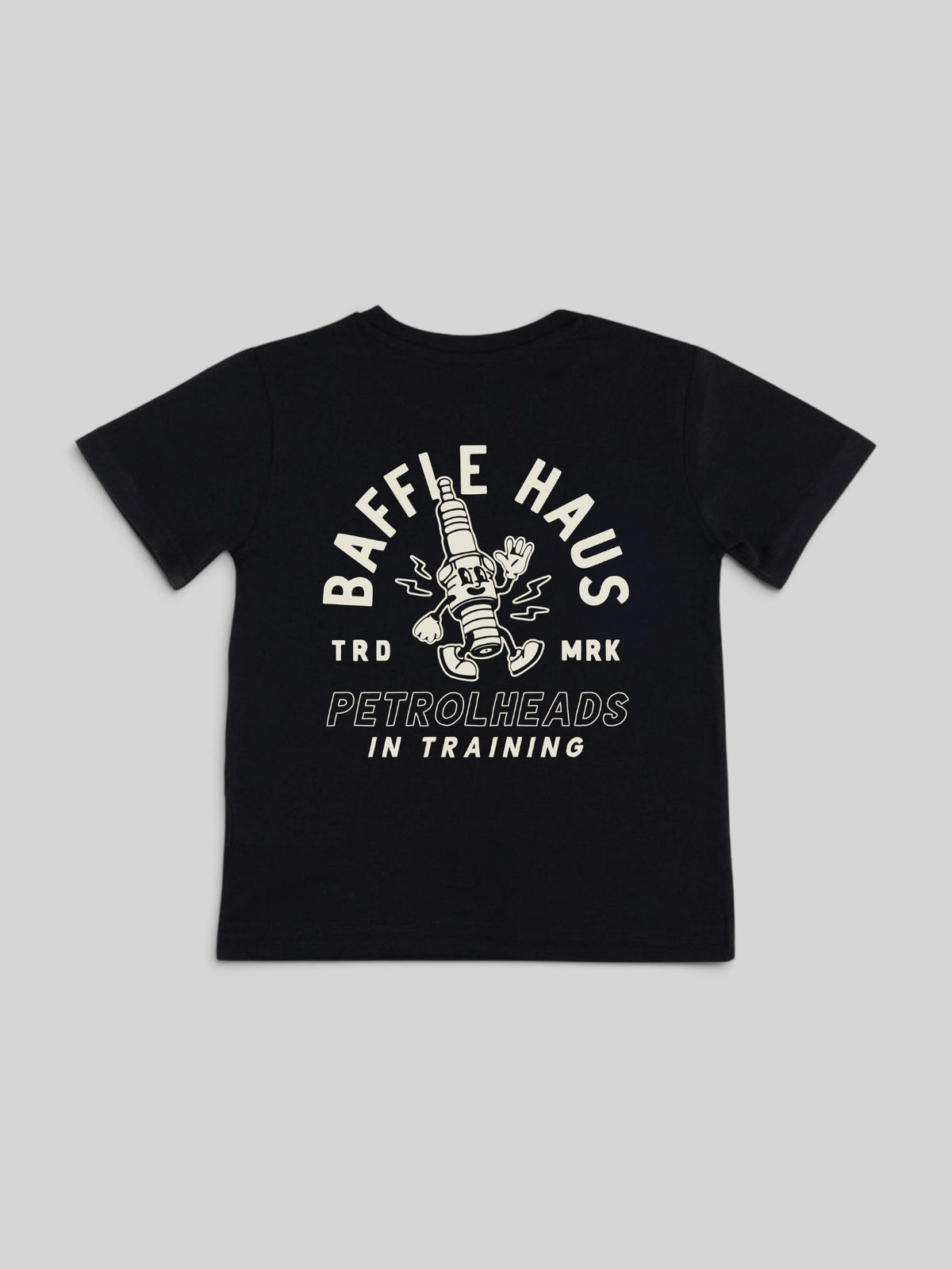 Baffle Haus kids black cotton t-shirt featuring a white Sparky the spark plug graphic on the back