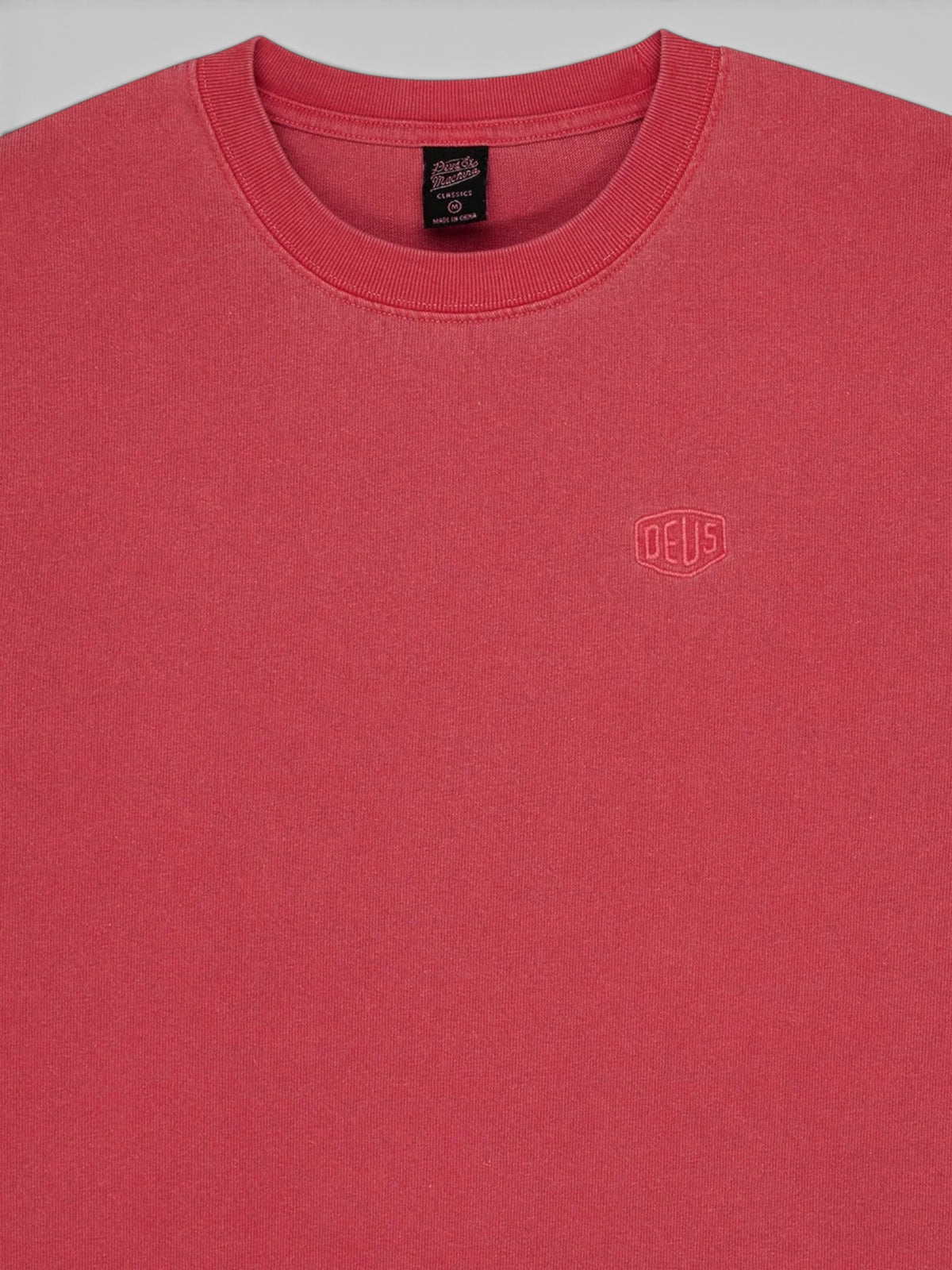 Baffle Haus Deus Shield garment dyed t-shirt in lava falls red featuring a small embroidered chest logo