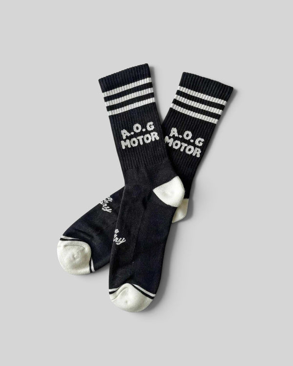 Baffle Haus Age Of Glory Marauder black and off-white cotton motorcycle socks with striped cuffs and logo detail