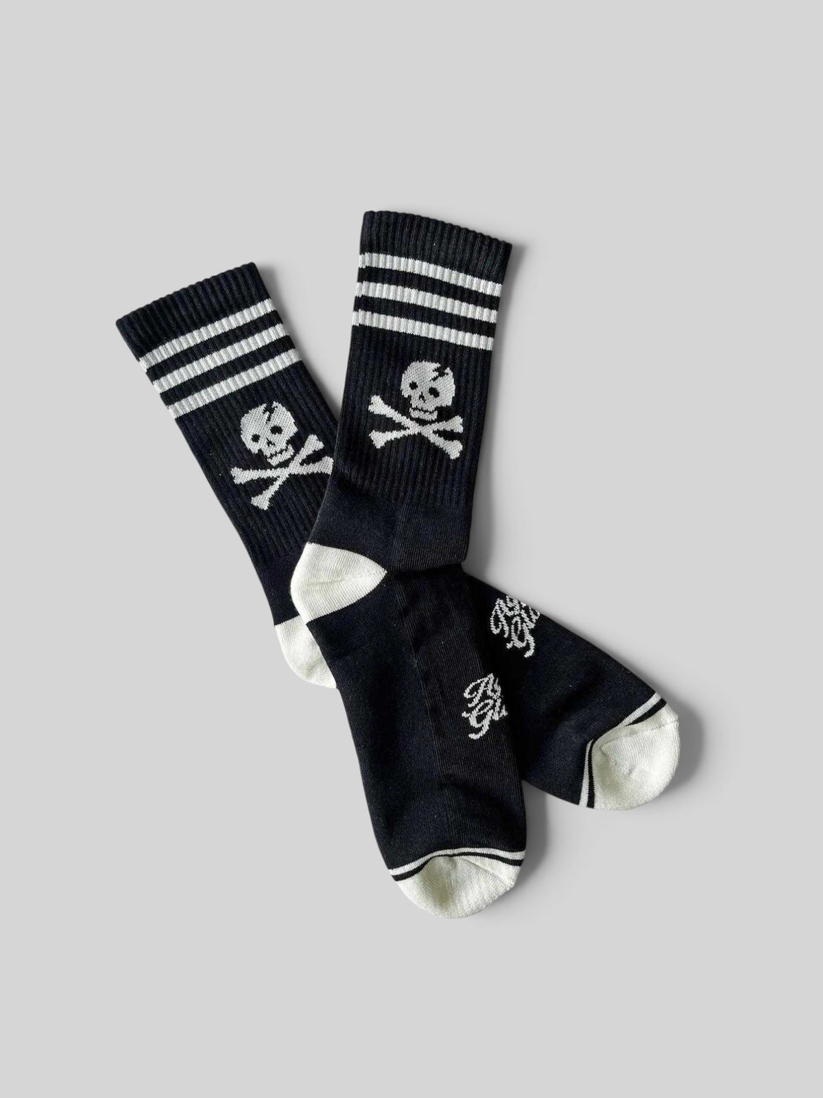 Baffle Haus Age Of Glory Marauder black and off-white cotton motorcycle socks with skull and crossbones graphic