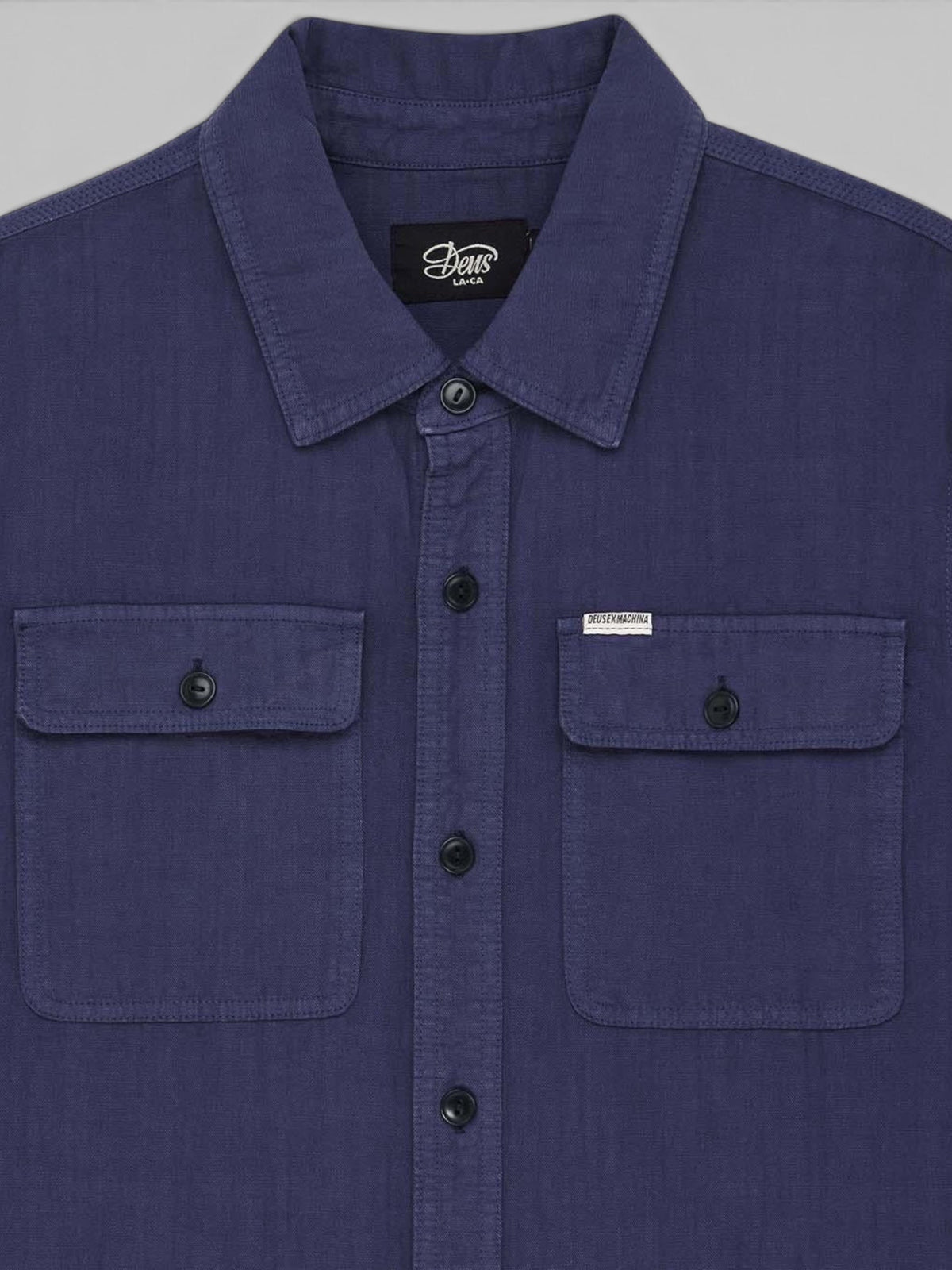 Baffle Haus Vacay Chambray long sleeve shirt in mechanic blue with chest flap pockets and corozo nut buttons