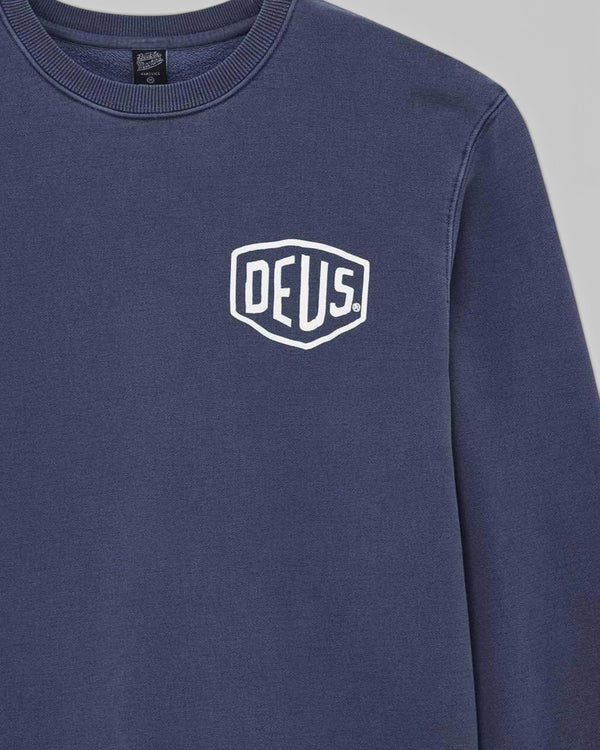 Baffle Haus Deus Shield crew neck sweatshirt in mechanic blue heavyweight loop back fleece with white chest graphic