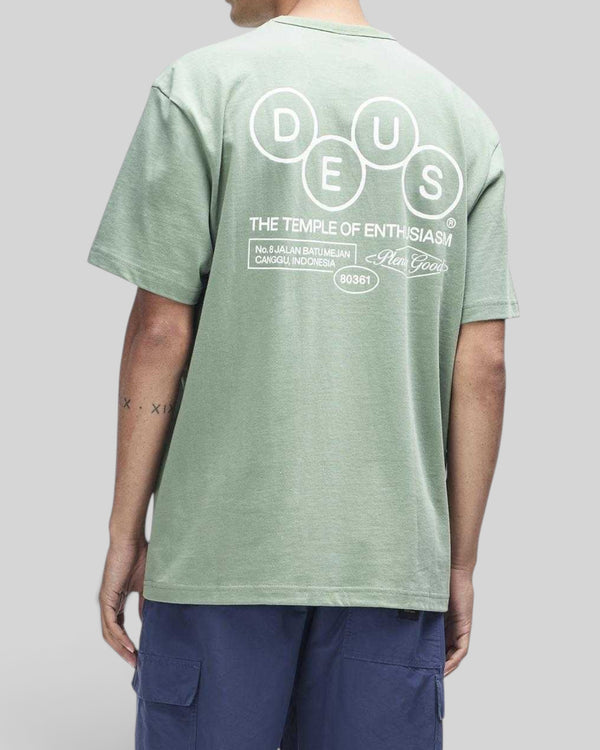 Baffle Haus Mechanism Tee in loden frost green organic cotton with white graphic print on the back