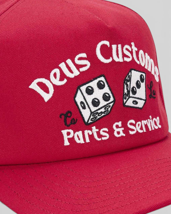 Baffle Haus melon red cotton twill cap with vintage-inspired Deus Customs dice embroidery on the front panel.