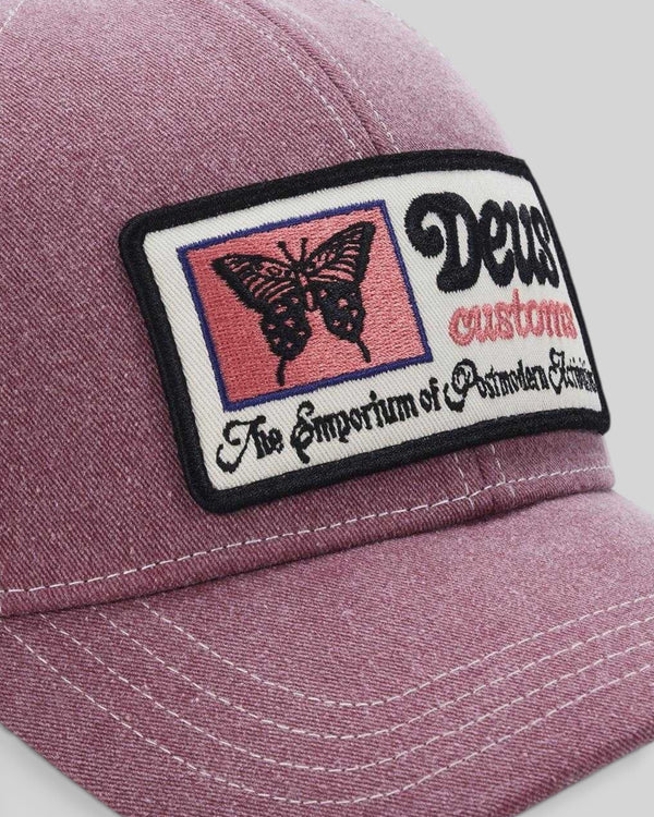 Baffle Haus Slapstick Trucker hat in melon red nylon with a detailed butterfly graphic twill patch on the front.