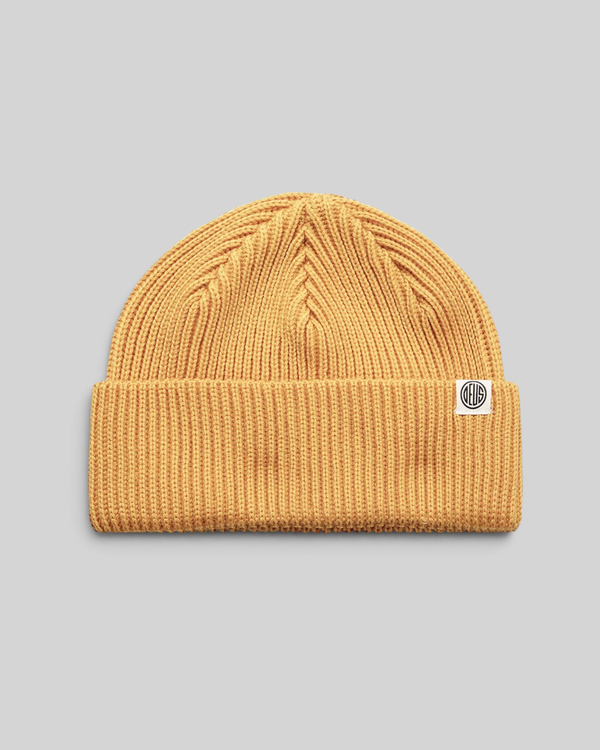 Baffle Haus Pill Merino Beanie in radiant yellow with a double fold turnover and branded clip label.