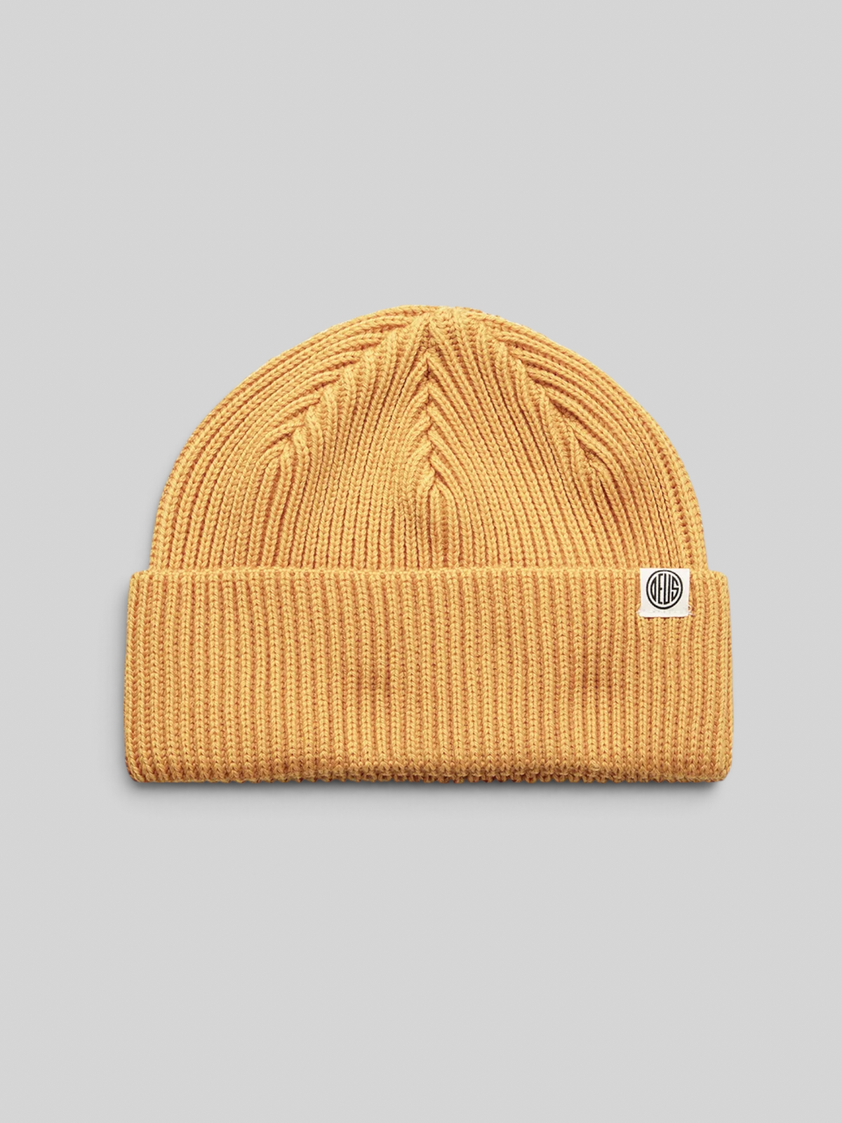 Baffle Haus Pill Merino Beanie in radiant yellow with a double fold turnover and branded clip label.