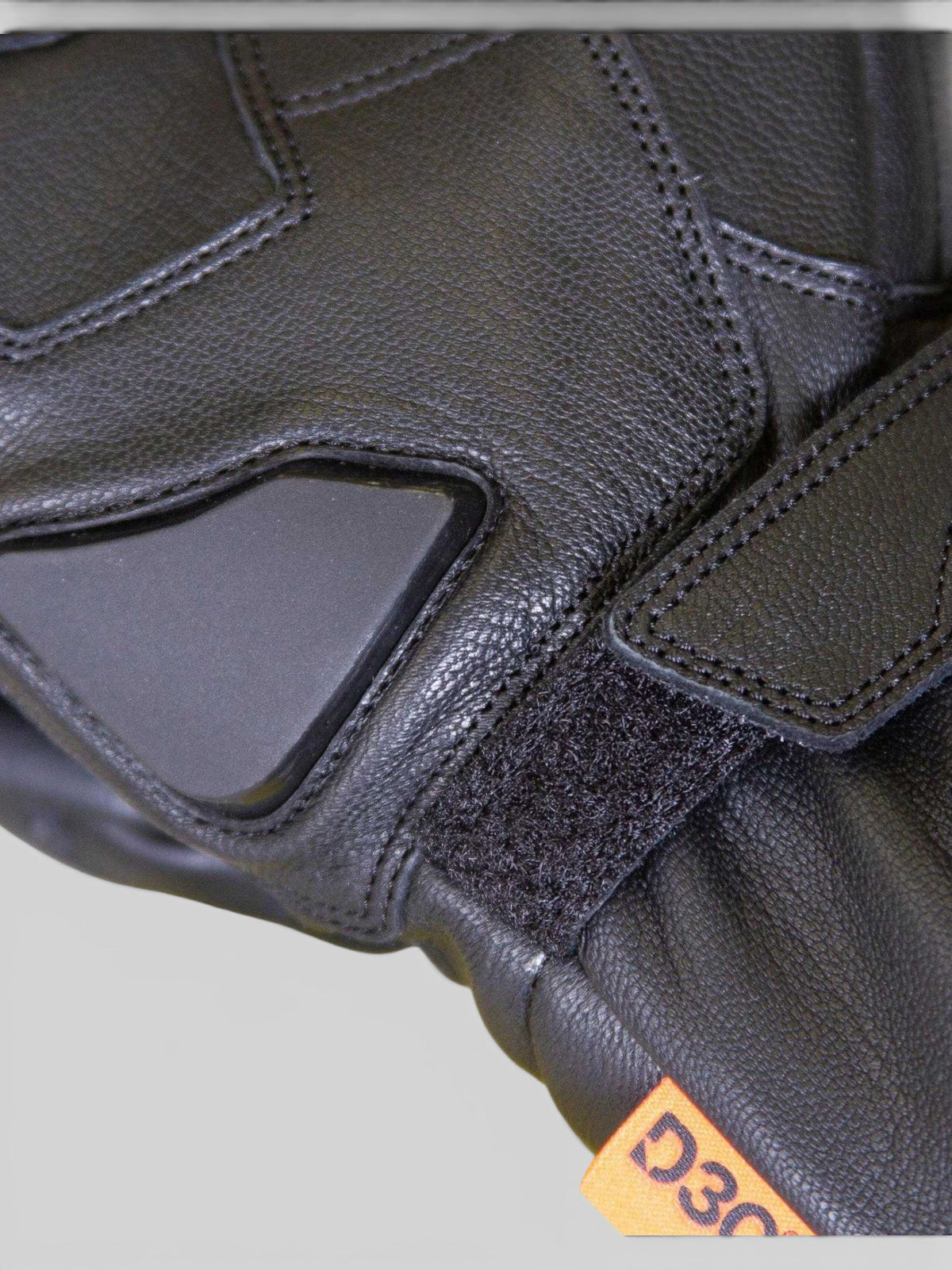 Baffle Haus Merlin Calton black leather motorcycle glove with D3O protective padding and Velcro wrist closure
