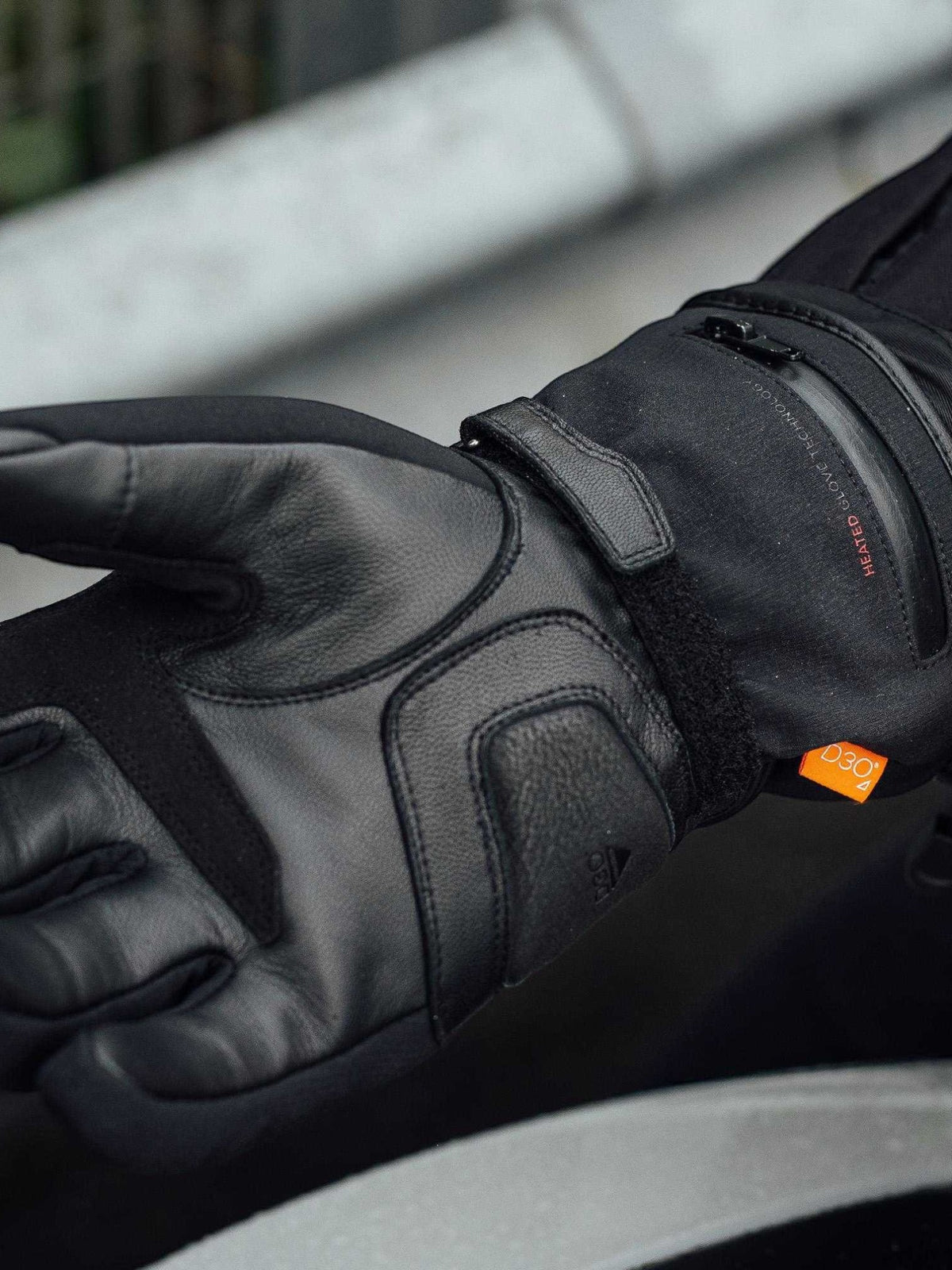 Baffle Haus Merlin Curborough black heated motorcycle gloves with leather palm, D3O knuckle protection, and zip cuff.