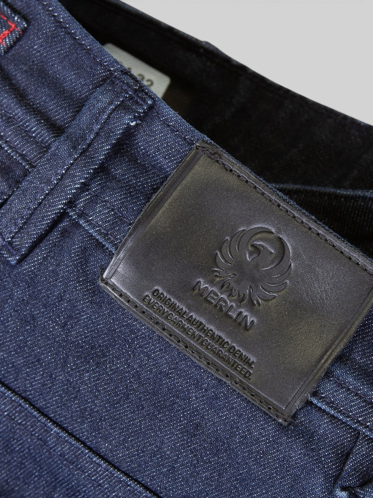 Baffle Haus Merlin Rivington AAA blue denim jeans featuring a black leather brand patch on the waistband
