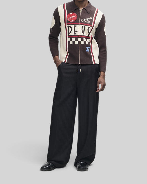 Baffle Haus Monte Carlo knit cardigan in java brown with graphic jacquard moto details, zip front, and patches.