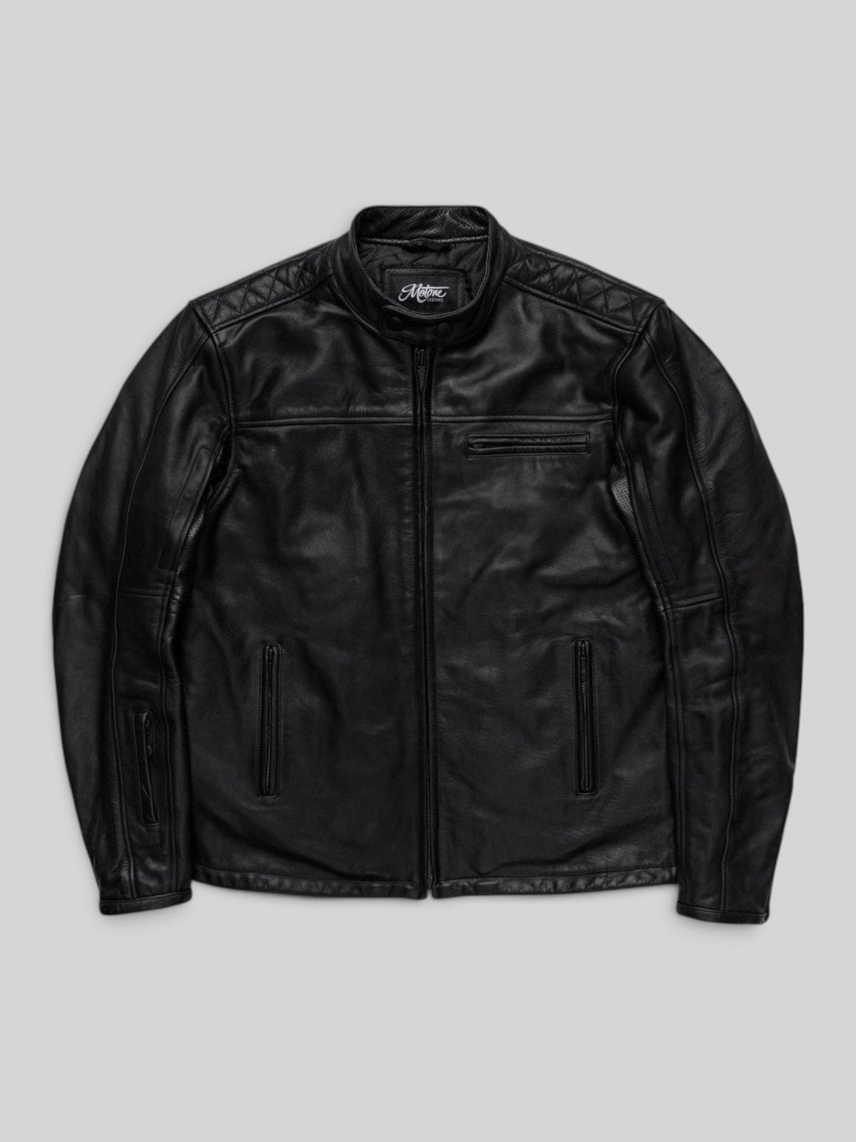 Baffle Haus Motone Revolver black cowhide leather motorcycle jacket with diamond-quilted shoulders and zip pockets.