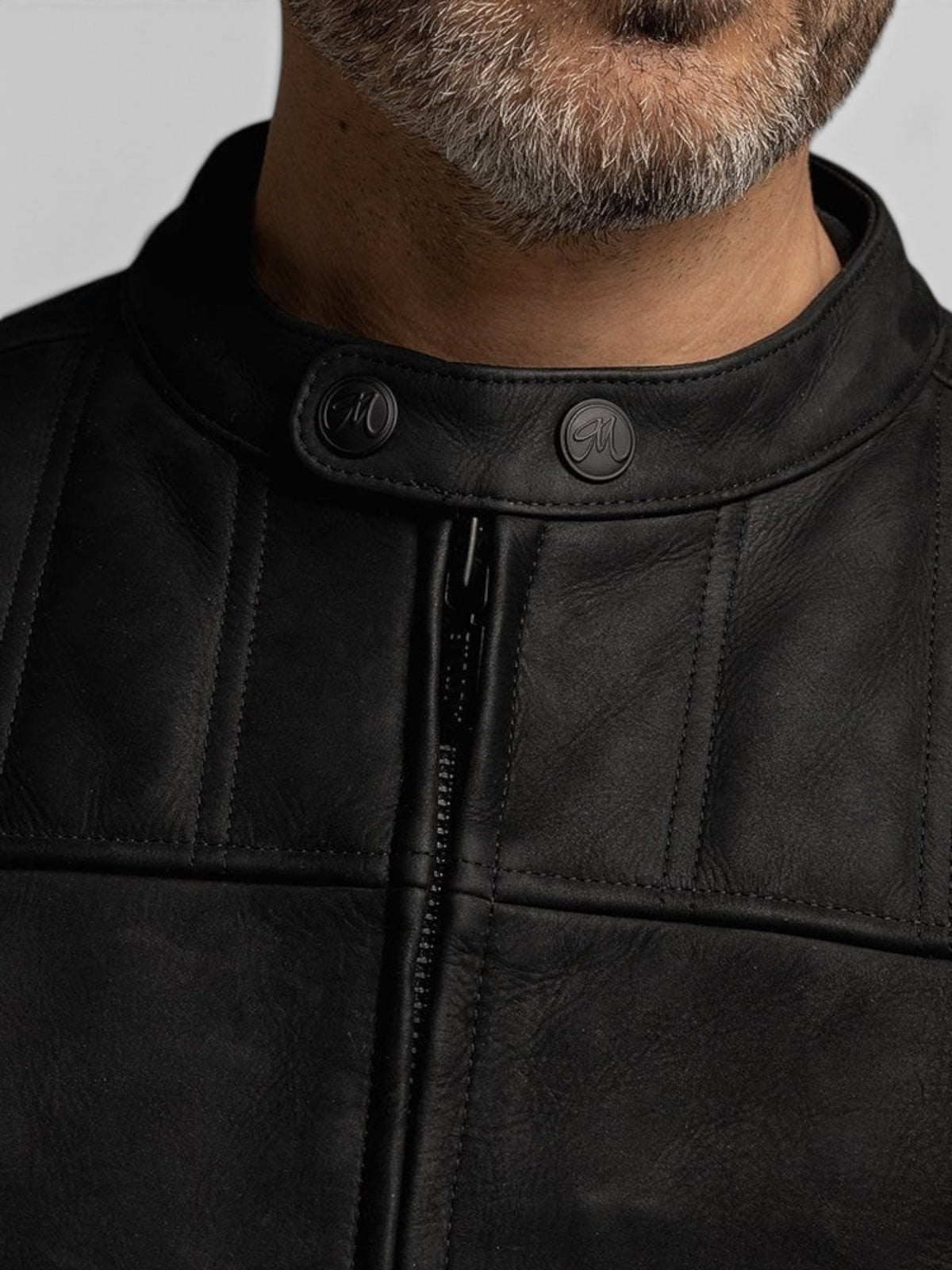 Baffle Haus Motone Shogun black nubuck leather motorcycle jacket with quilted chest panels and branded press studs.