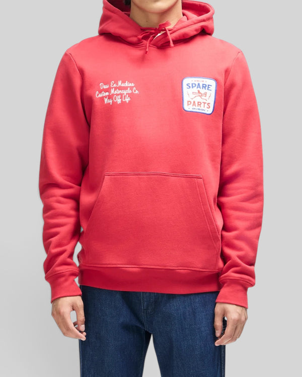 Baffle Haus Mudflap hoodie in cherry red organic cotton fleece with chest embroidery and kangaroo pocket