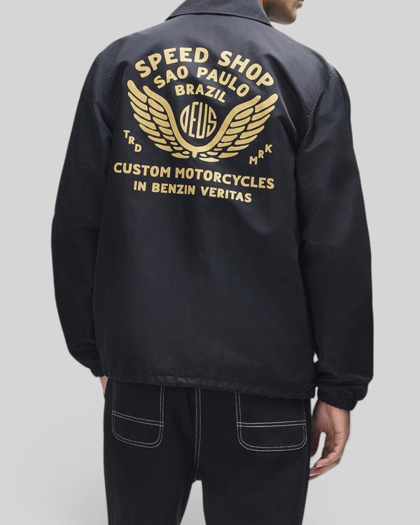Baffle Haus Munificence black recycled nylon coach jacket with gold graphic print on the back