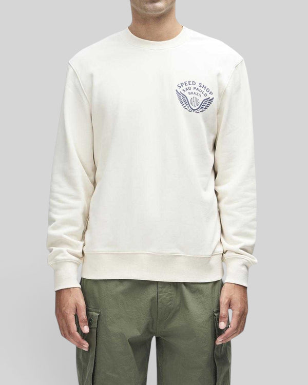 Baffle Haus Munificence crew fleece in dirty white with chest graphic print, ribbed neck, and boxy fit
