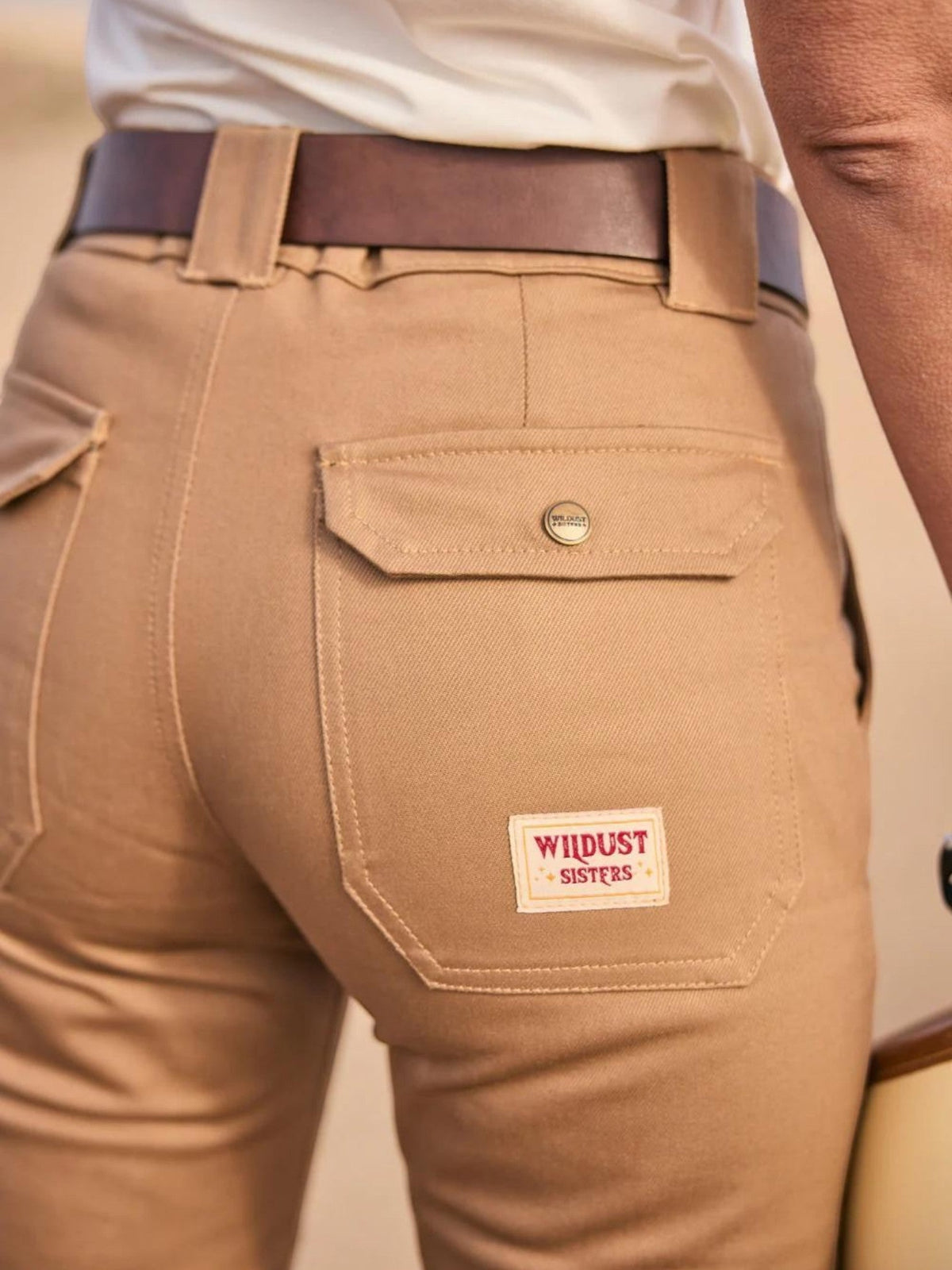 Baffle Haus mustard cargo motorcycle trousers with rear patch pockets, branded label, and wide belt loops